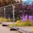 Temporary fencing with stabilizing footings at a construction site