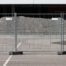 Temporary fencing installed on asphalt with solid rubber footings