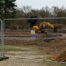 Temporary block and panel fencing surrounding a construction site
