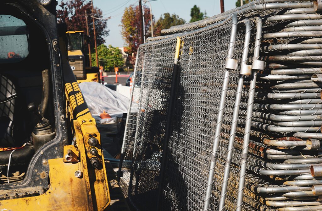 Temporary fencing being removed after a completed project