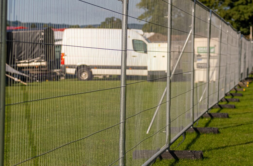 Portable temporary fencing around a changing construction work zone