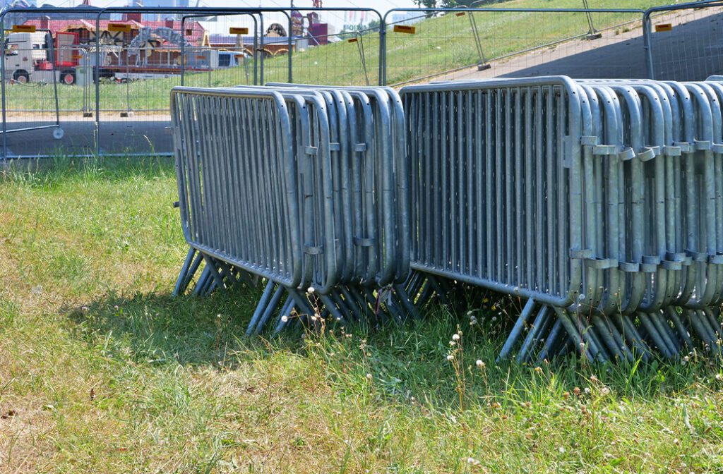 Separate temporary fenced areas for construction work and equipment storage