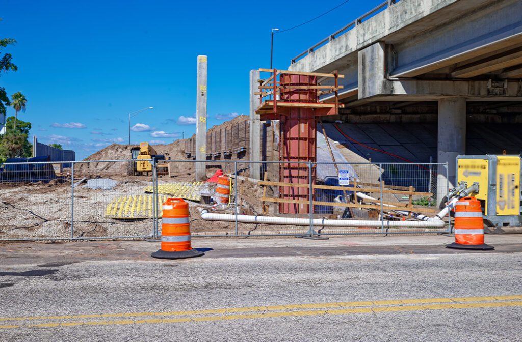 Separate temporary fenced areas for construction work and equipment storage