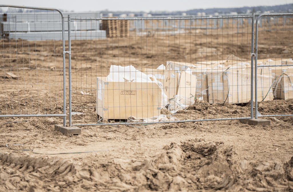 Freestanding block-and-panel fencing that can be reconfigured during construction
